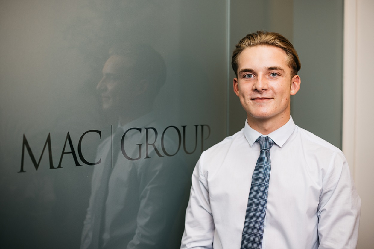 A landscape shot of Todd Crellin with the MAC logo