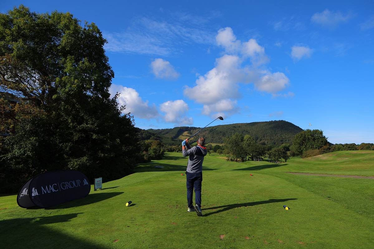 A photo of someone teeing at at the MAC Golf Day 2024