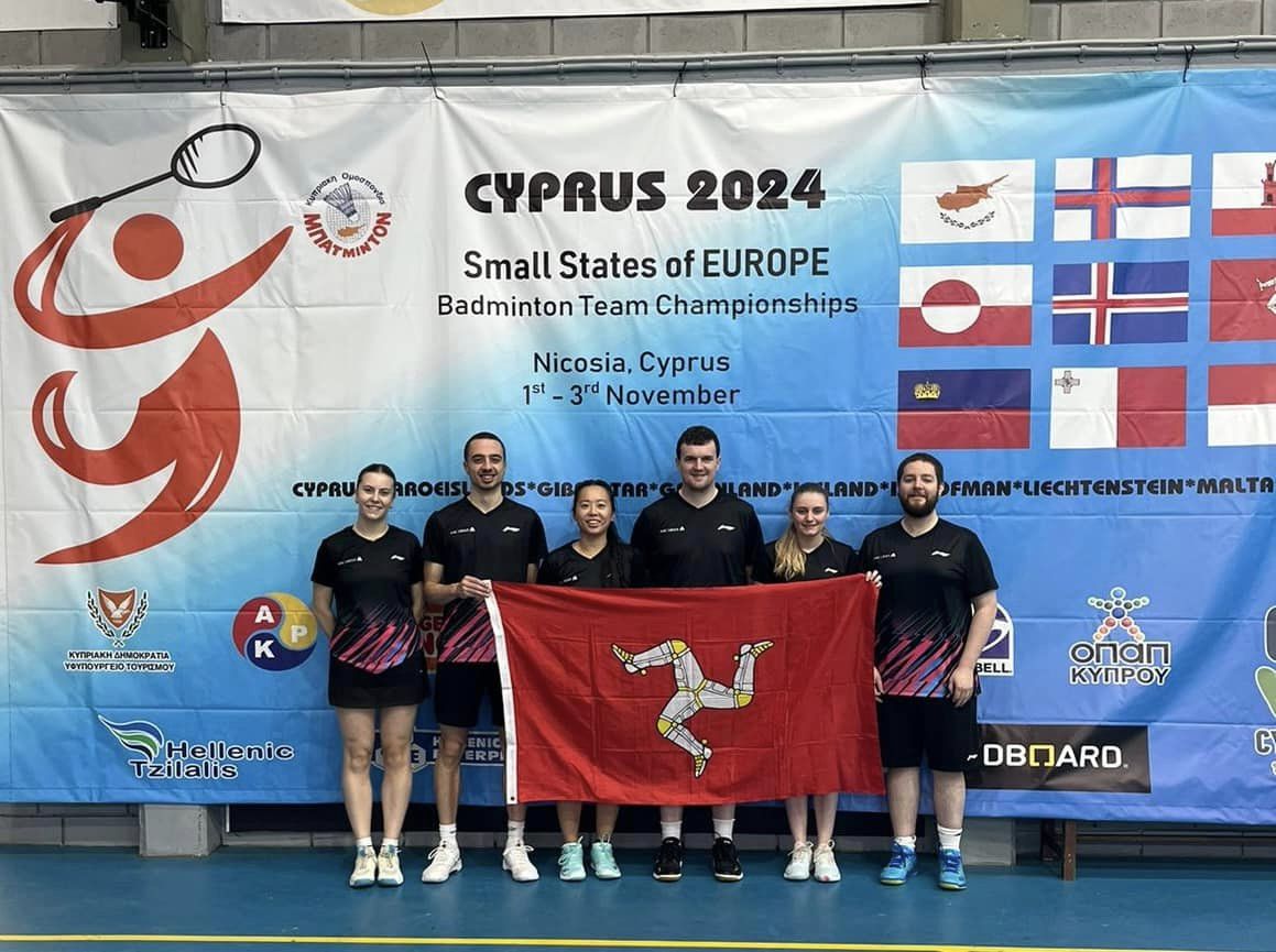 A photo of the badminton team at the competition