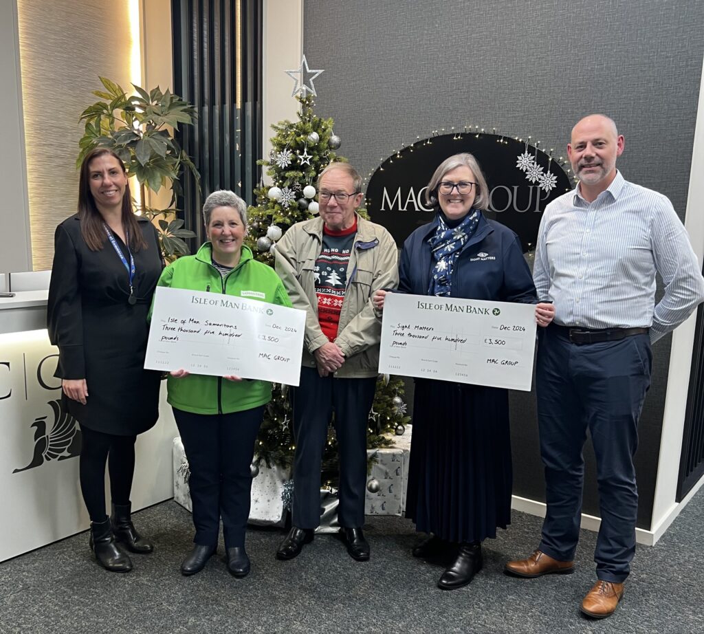 A photo of Ed Walter and Rebecca Netten with representatives from Sight Matters and Samaritans