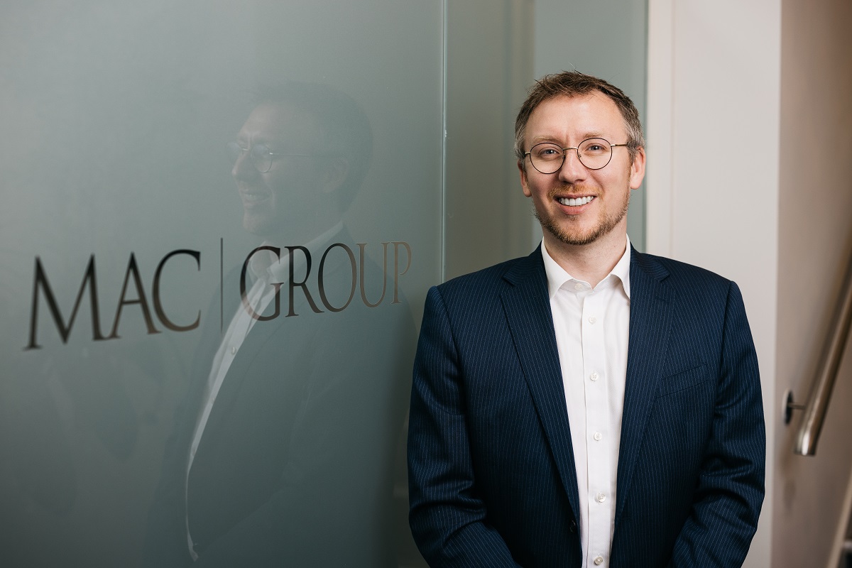 A portrait of Mark Murley next to the MAC logo