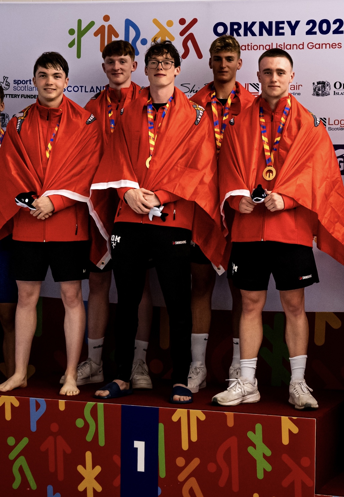 Swim team on the podium