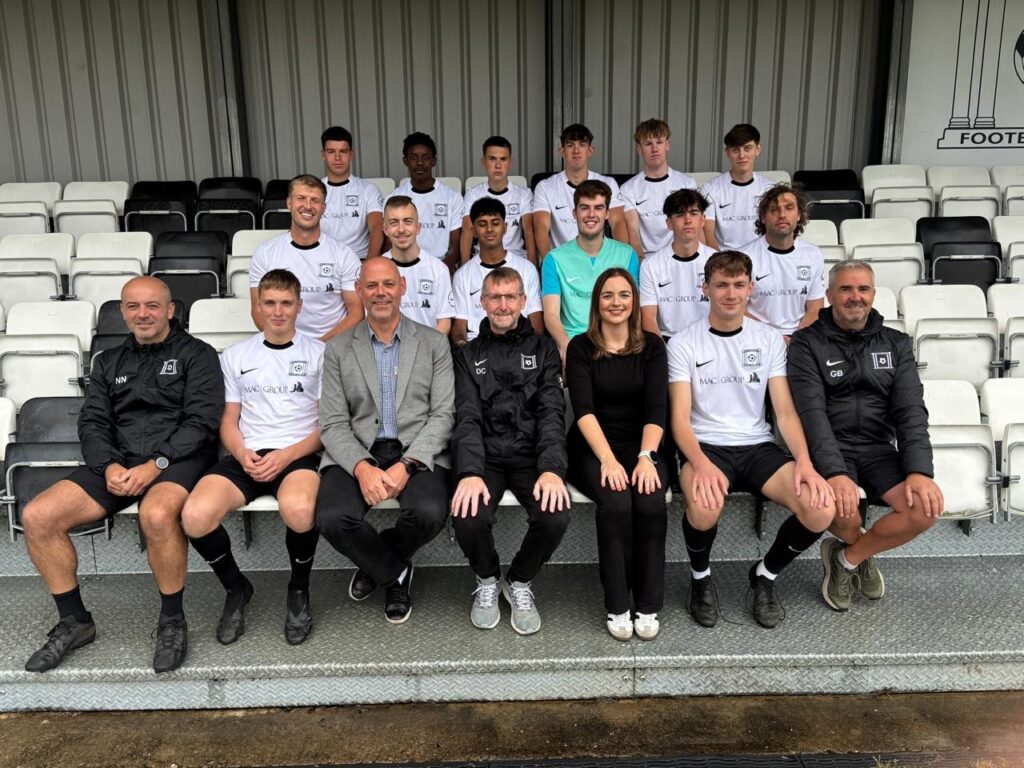 A photo of the combi team wearning the MAC branded shirts