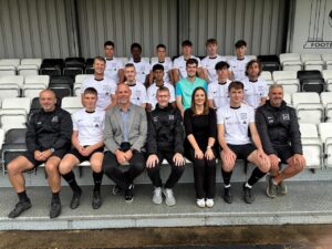 A photo of the combi team wearning the MAC branded shirts