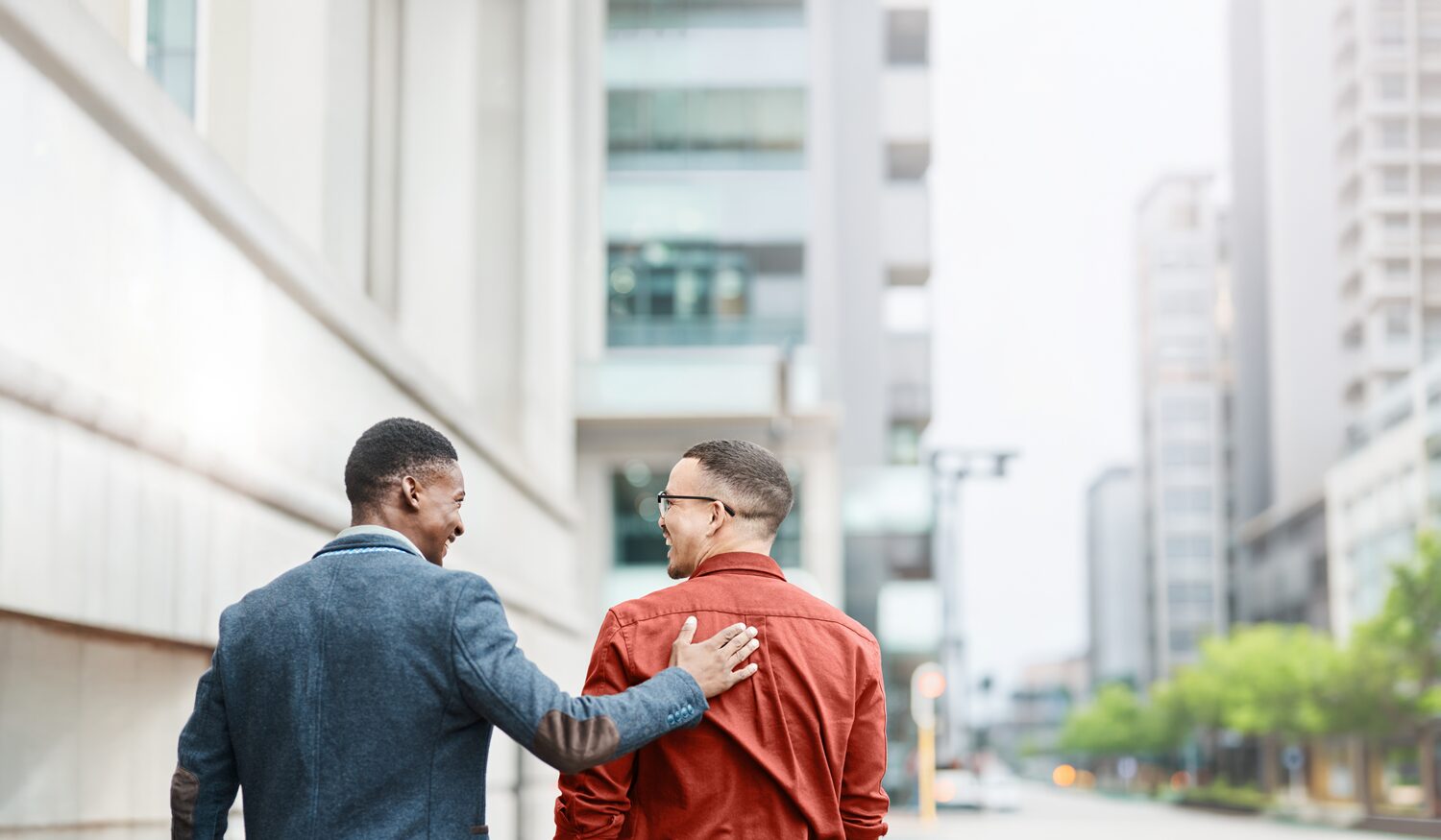 An image of two men walking down the street